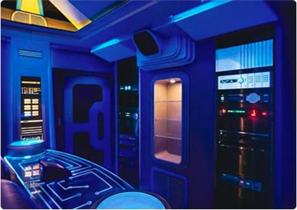 Custom home theater equipment rack area with integrated lighting and high-end audiovisual components.