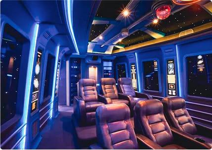 Star Wars inspired luxury home cinema with ambient blue lighting, star ceiling, and premium leather seating.