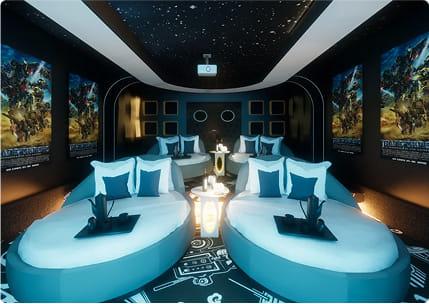 Modern Transformers inspired cinema room with rounded seating, futuristic design, and starry ceiling lighting.